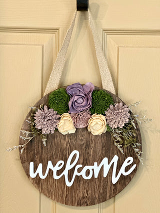 ‘Welcome’ Wood Flower Round - Brown with Green, Purple and Cream